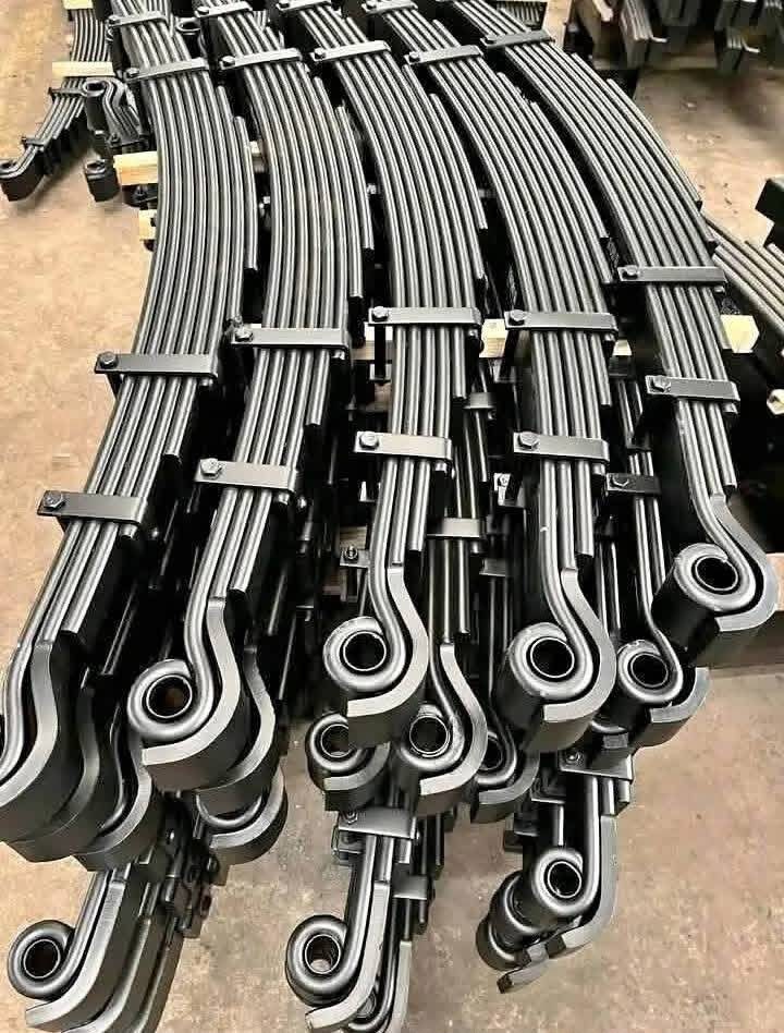 Freshly fabricated heavy truck leaf spring packs with eye bushes, ready for dispatch