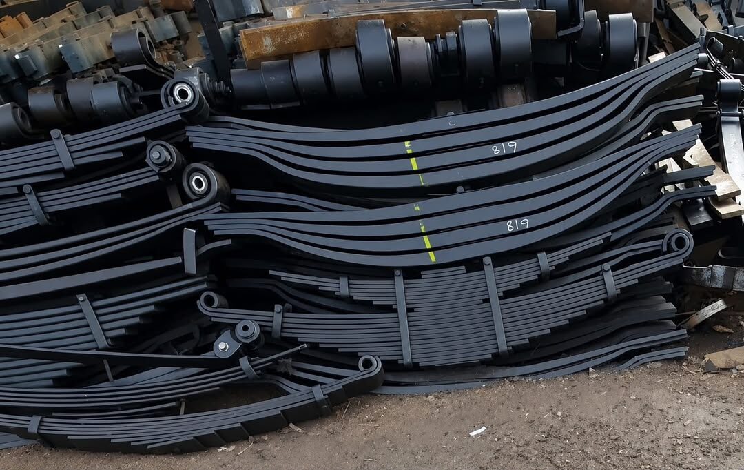 Stock of heavy truck multi-leaf springs and axle components at Petfetch Springs Harare